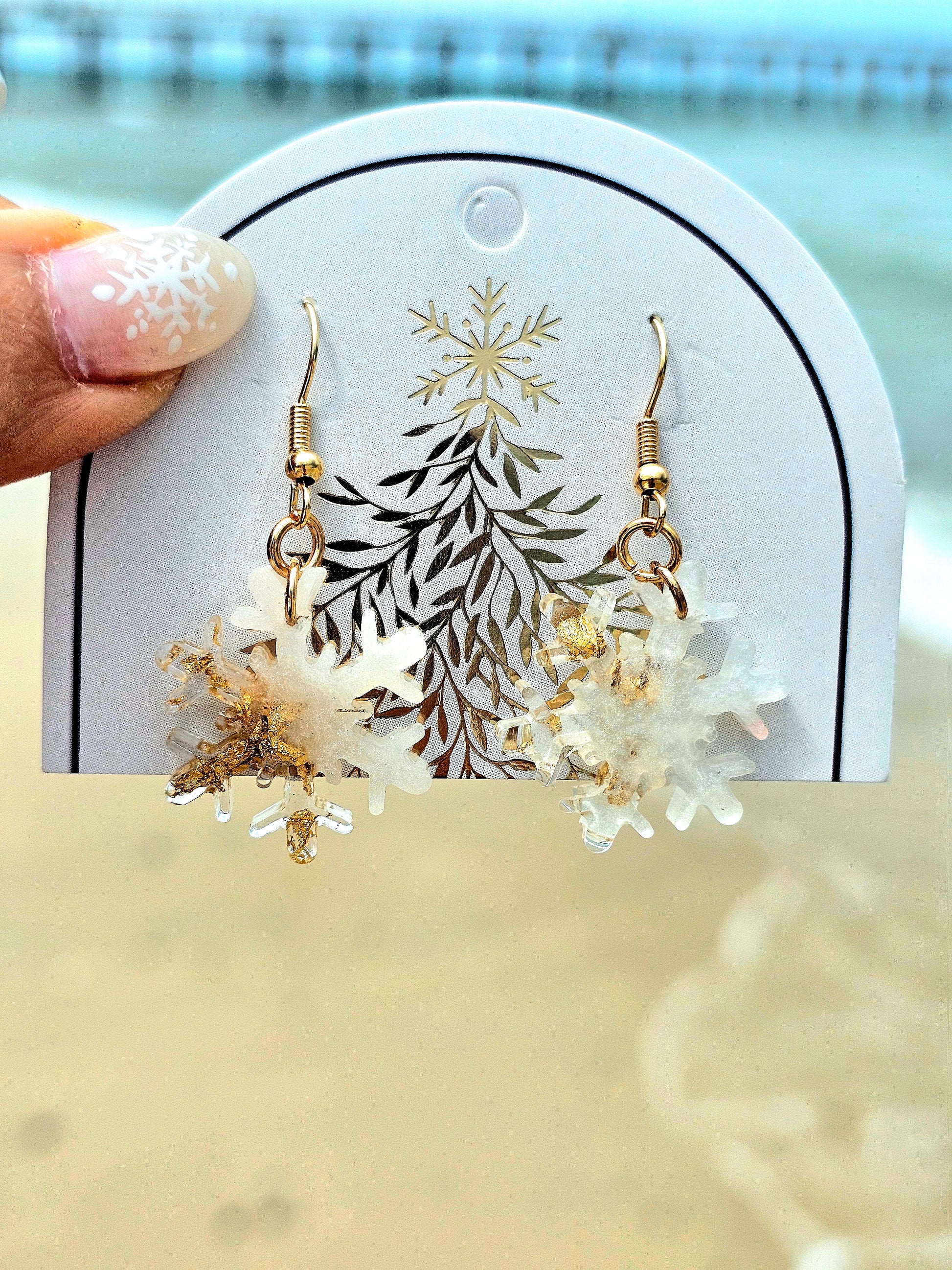 Hand-made snowflakes earringsThese one-of-a-kind hand-crafted snowflake earrings are our exclusive design. Add a touch of individuality and sophistication to your collection with these stunning white earrings. All our designs are made with a high-quality