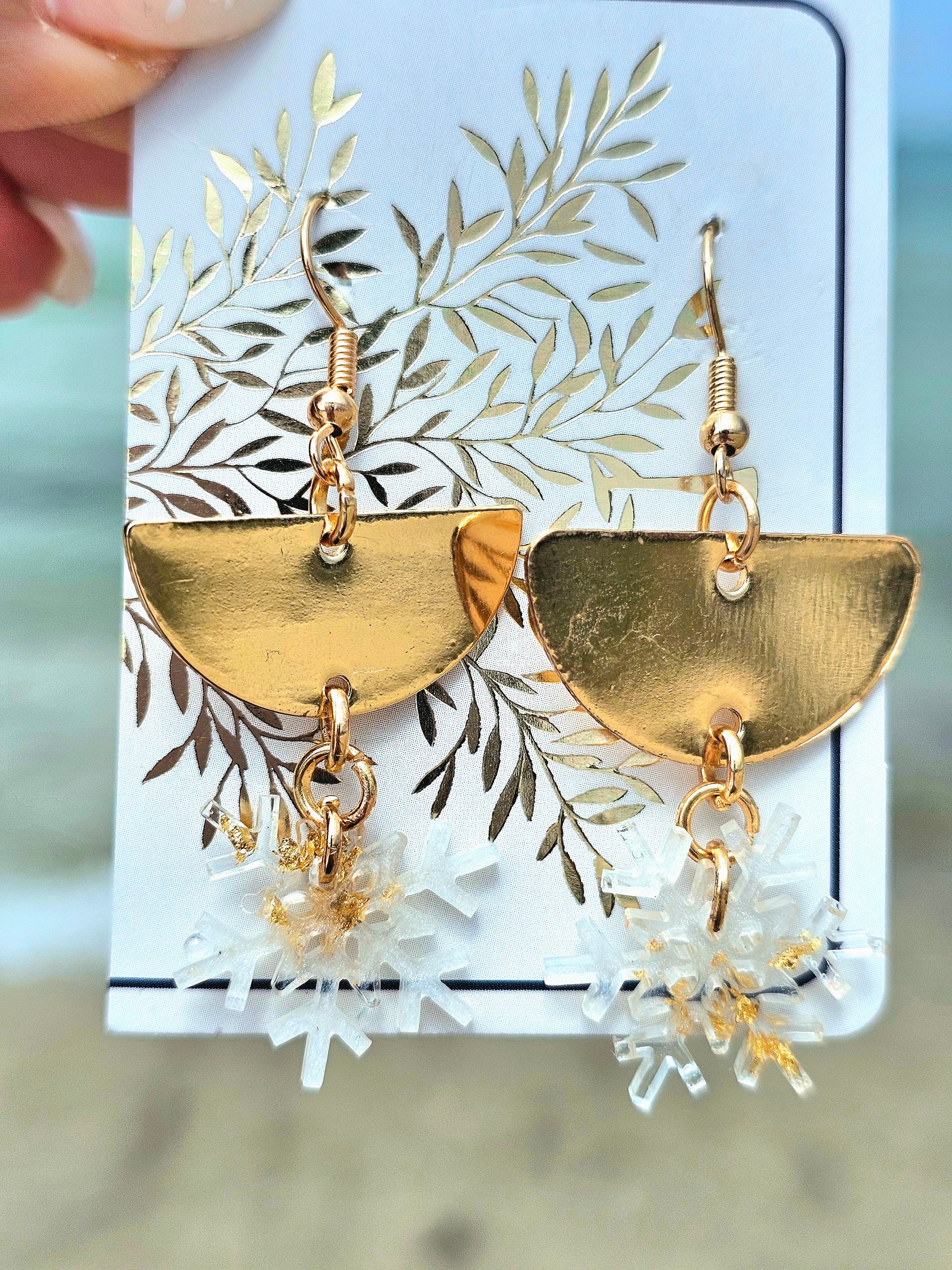 Hand-made snowflakes earringsThese one-of-a-kind hand-crafted snowflake earrings are our exclusive design. Add a touch of individuality and sophistication to your collection with these stunning white earrings. All our designs are made with a high-quality