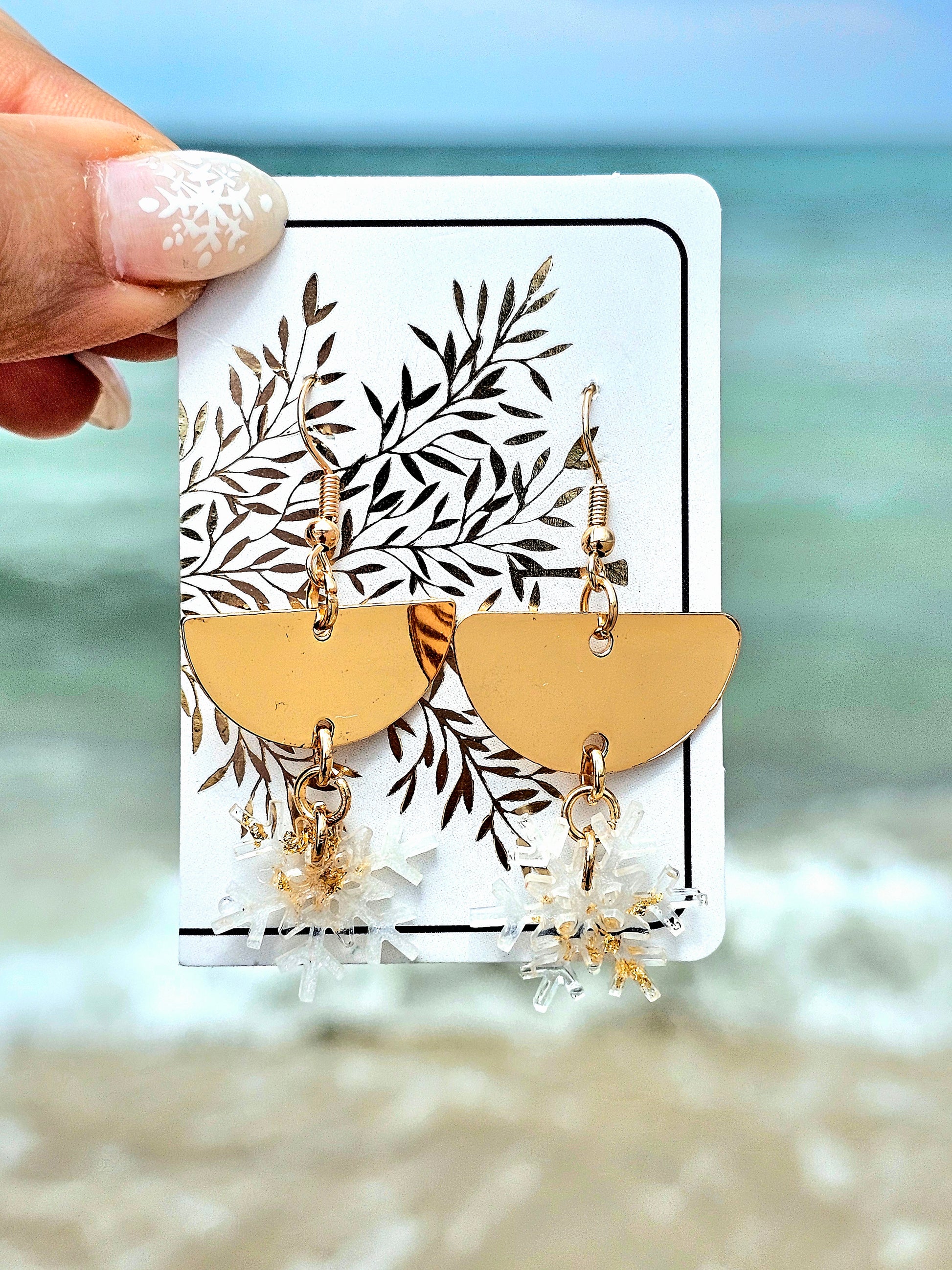 Hand-made snowflakes earringsThese one-of-a-kind hand-crafted snowflake earrings are our exclusive design. Add a touch of individuality and sophistication to your collection with these stunning white earrings. All our designs are made with a high-quality