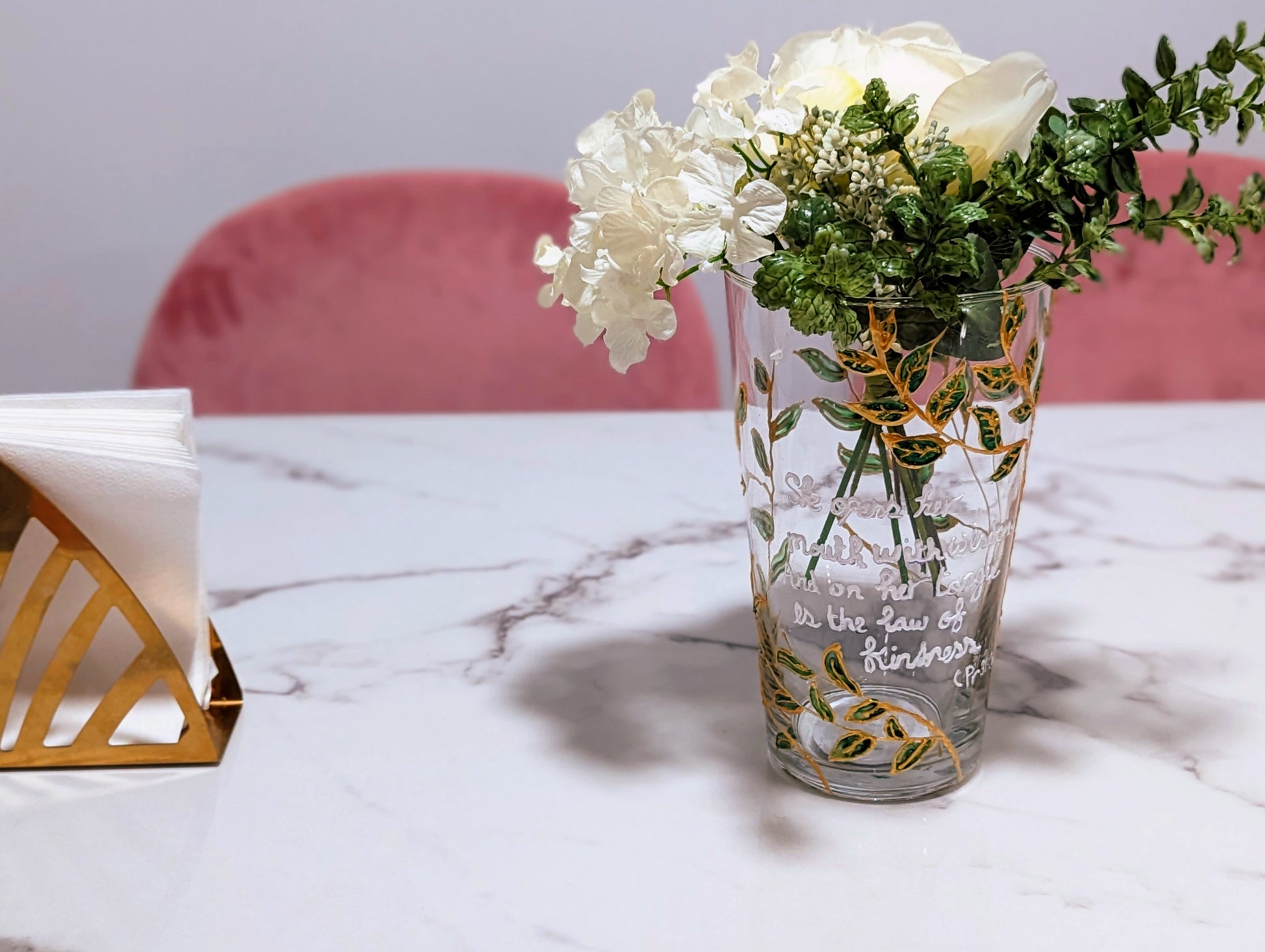 Personalised hand-painted glass vase with green and gold leavesThis hand-painted glass vase features a unique green and gold leaves and tree design, making it a 100% original piece of art. Each vase is hand-painted, ensuring no two are alike. Make it even