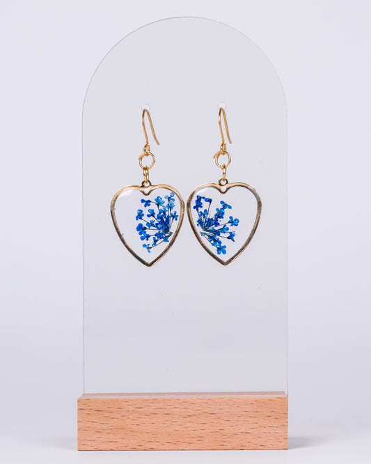 Handmade gold-plated clear heart-shaped earrings with blue flowers