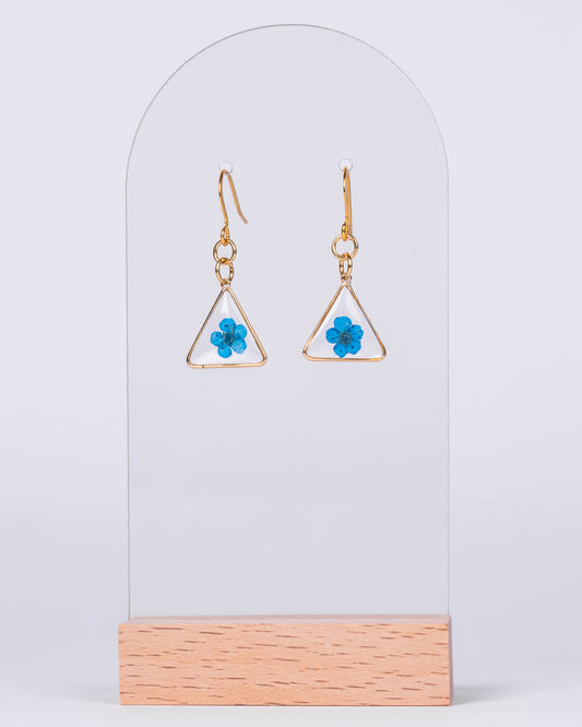 Handmade gold-plated earrings with dried blue baby flowers