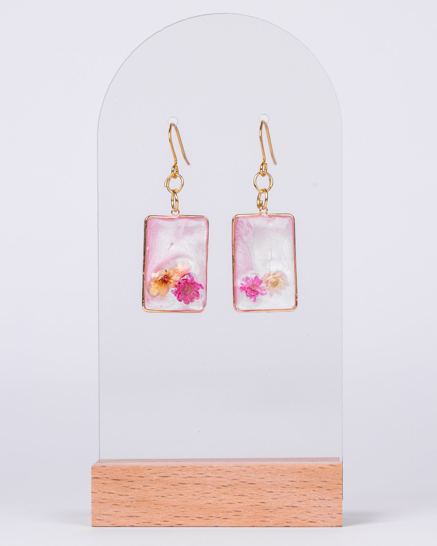 Handmade gold-plated pink and clear earrings with genuine flowers