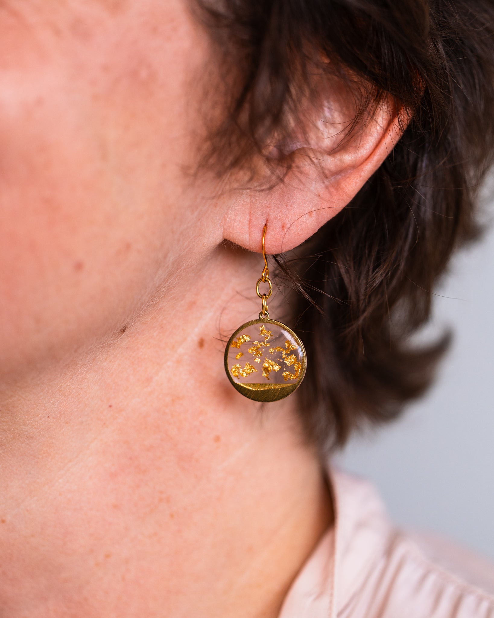 "Australian handmade earrings with gold-plated hooks and clear resin drops"