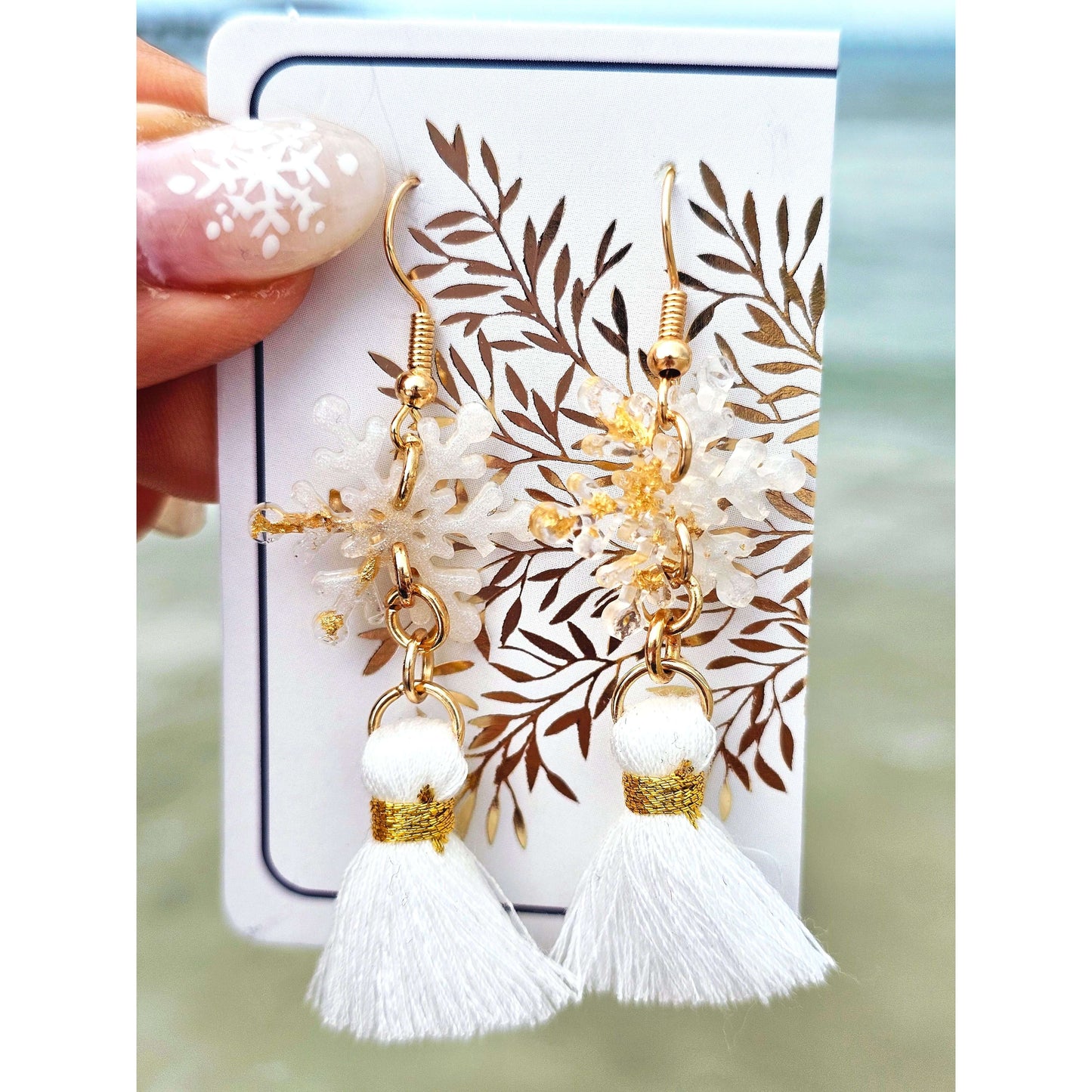 Handmade gold-plated snowflakes earringsThese one-of-a-kind hand-crafted snowflake earrings are our exclusive design. Add a touch of individuality and sophistication to your collection with these stunning white earrings.All our designs are made with a hig