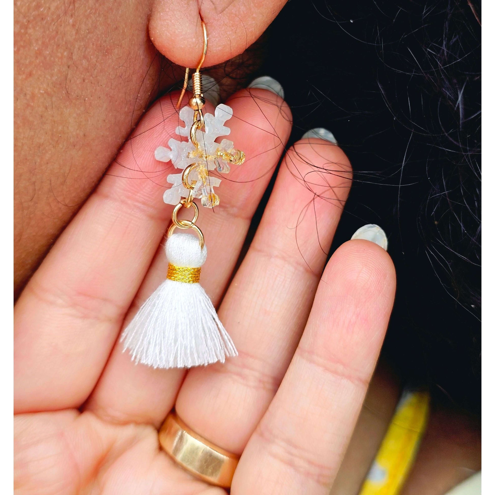 Handmade gold-plated snowflakes earringsThese one-of-a-kind hand-crafted snowflake earrings are our exclusive design. Add a touch of individuality and sophistication to your collection with these stunning white earrings.All our designs are made with a hig