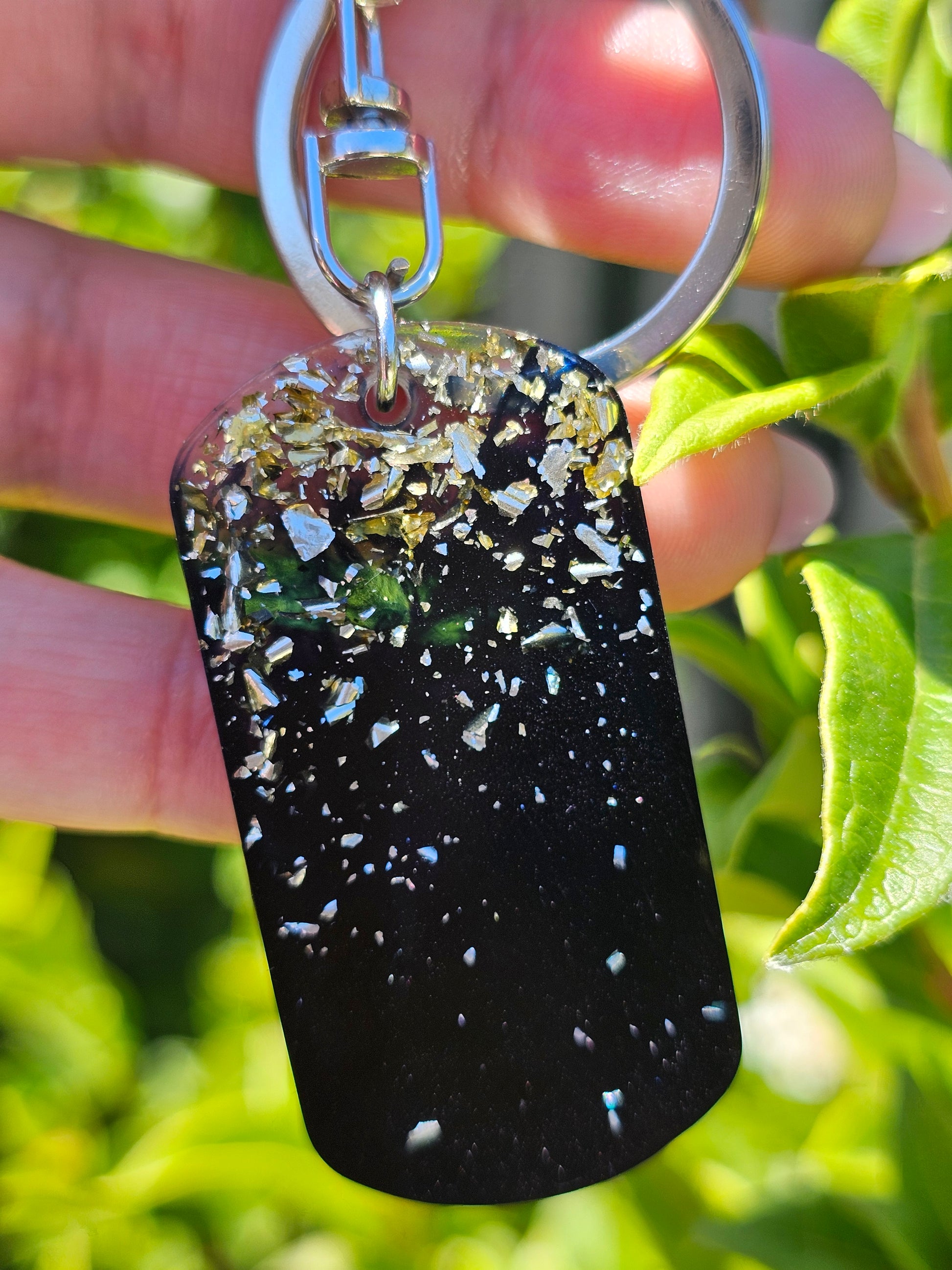 Personalised hand-made keychains for MenTransform your keychain with a custom-made, premium-quality keychain crafted from top-grade epoxy resin and a silver-plated chain. This combination ensures superior durability and scratch-resistance. Make a statemen