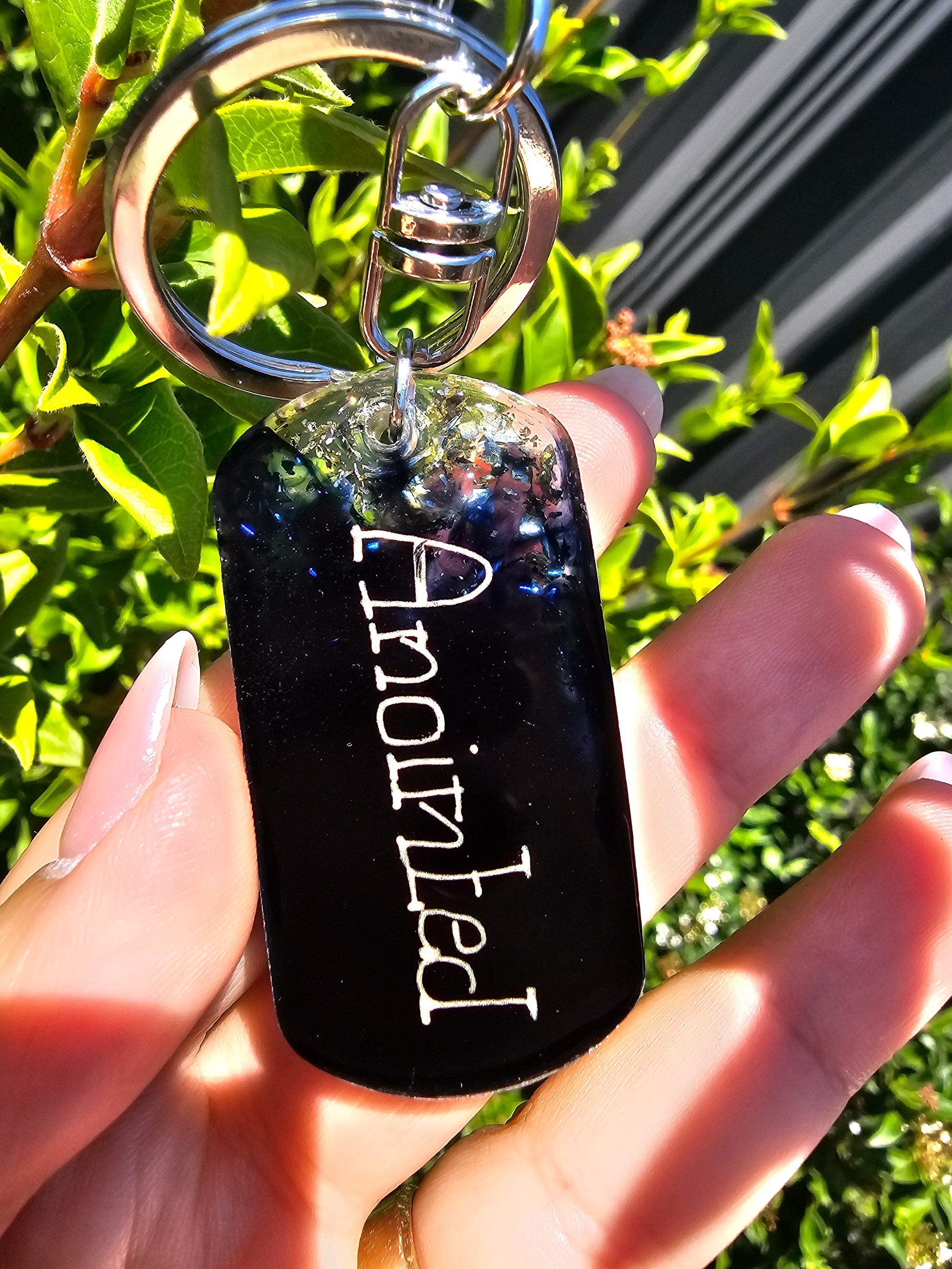 Personalised hand-made keychains for MenTransform your keychain with a custom-made, premium-quality keychain crafted from top-grade epoxy resin and a silver-plated chain. This combination ensures superior durability and scratch-resistance. Make a statemen