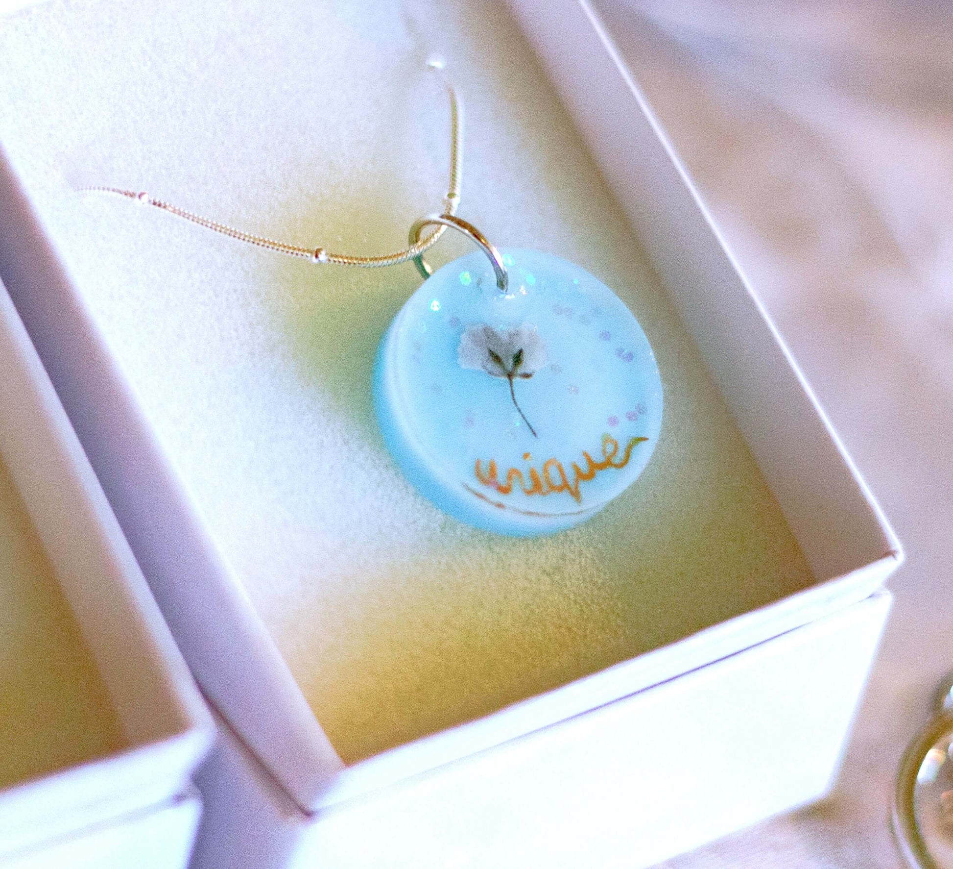 Personalised hand-made gold plated necklace (baby blue)There is no better and more special gift for any Christian woman than this uniquely designed handmade necklace, featuring a beautiful combination of vibrant real dried flowers. Make it a more special