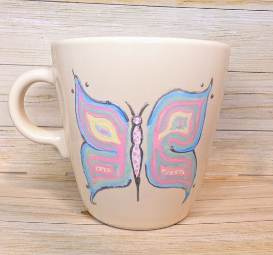 Personalised hand-painted vibrant butterfly mug (Dish washer-safe)"Release your own colors and watch the world get painted" Enjoy the beauty of nature and artistry with our vibrant and full of life hand-painted stoneware mug. This mug is adorned with a st