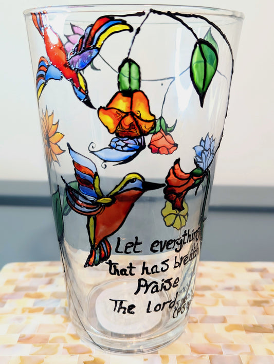 Personalised hand-painted glass vase with colourful parrots, flowers and butterflies.This hand-painted glass vase features a unique depiction of flying parrots surrounded by vibrant flowers and butterflies, capturing the essence of colourful nature and jo