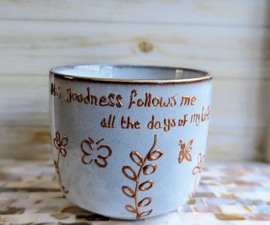 Personalised hand-painted dancing flowers mug. (Ps 23:6) Surely goodness and mercy shall follow me All the days of my life;Enjoy the beauty of nature and artistry with our vibrant and full-of-life hand-painted stoneware mug. This mug is adorned with a stu