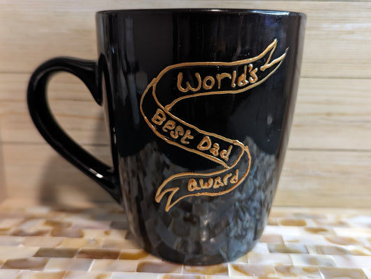 Personalised hand-painted stoneware black mug. World's best dad. Father's Day mugThis personalised stoneware black mug is the perfect gift to show your appreciation to your dad. Whether it is a birthday, Christmas or Father`s day gift, It will surely put