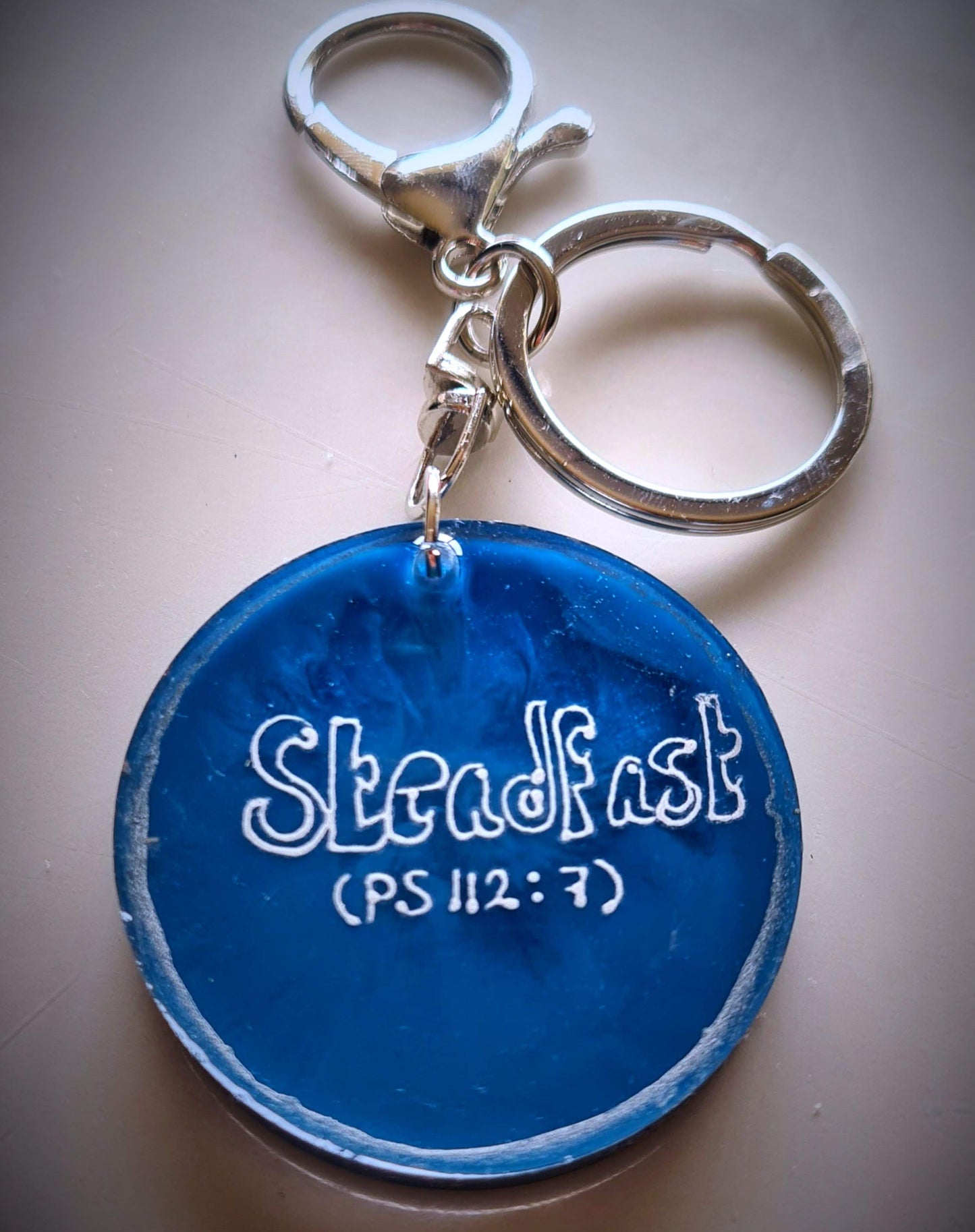 Personalised hand-made keychains for MenTransform your keychain with a custom-made, premium-quality keychain crafted from top-grade epoxy resin and a silver-plated chain. This combination ensures superior durability and scratch-resistance. Make a statemen